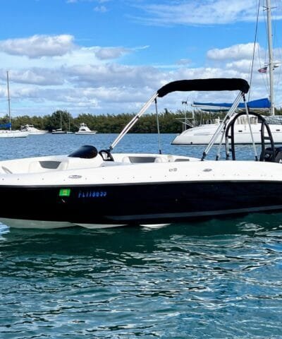 Bayliner E18 Black rental boat with the Miami skyline behind