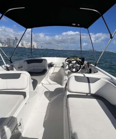 Inside the Bayliner E18: helm and seating for up to 8 people