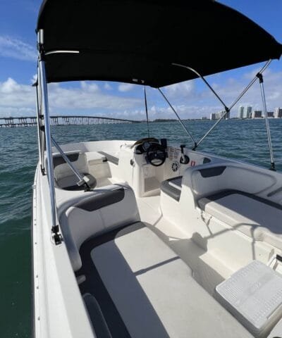 Bayliner E18 interior with seating under the bimini shade