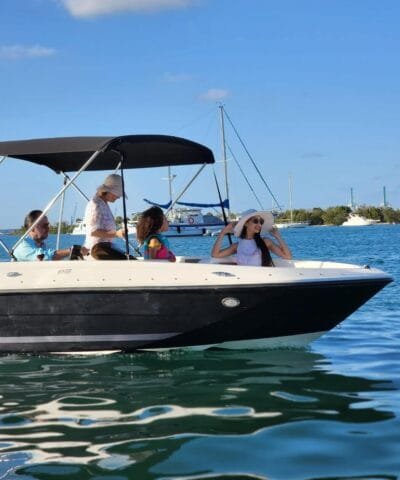 Family on a Bayliner E18 Black boat rental in Miami