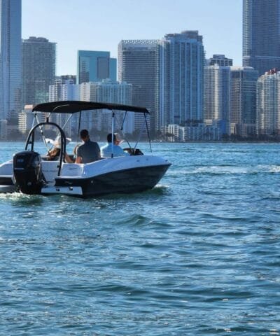 Bayliner E18 Black near the Miami skyline