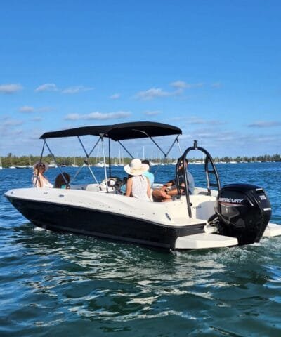 Guests on board a Bayliner E18 rental boat in Miami